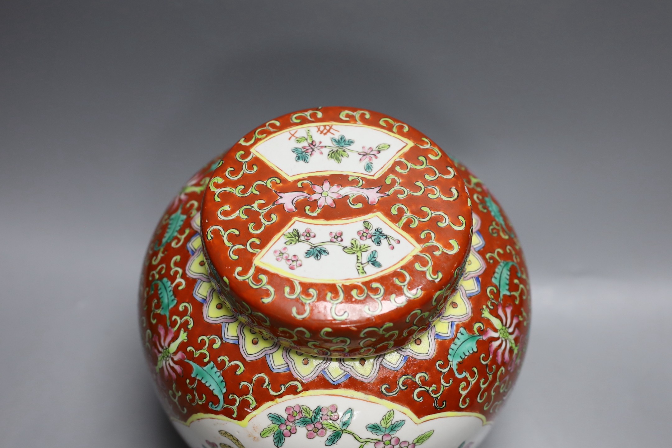 A Chinese coral ground jar and cover, 23cm